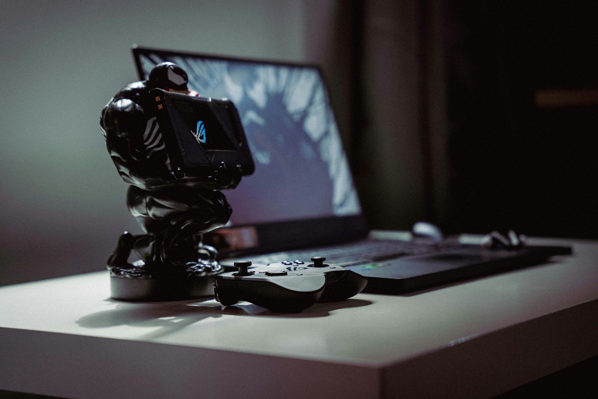 a toy action figure on a laptop
