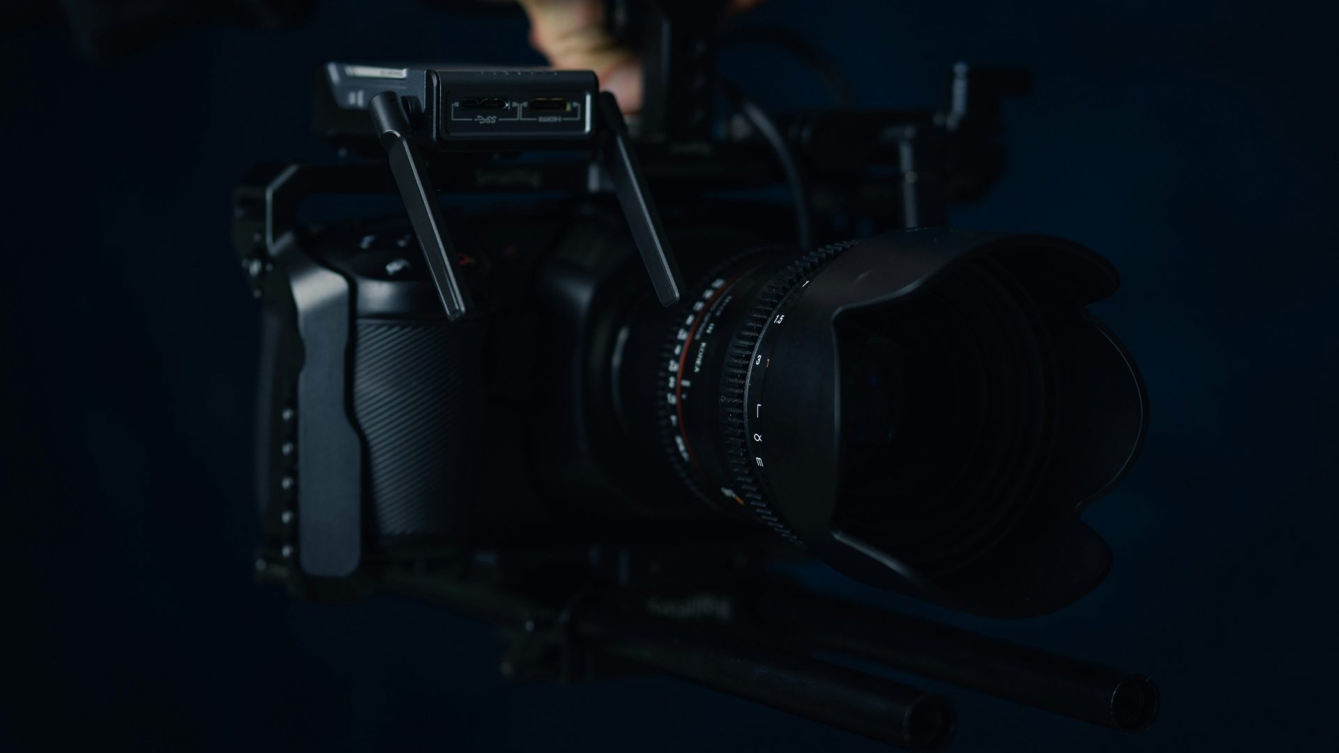 black nikon dslr camera on black surface