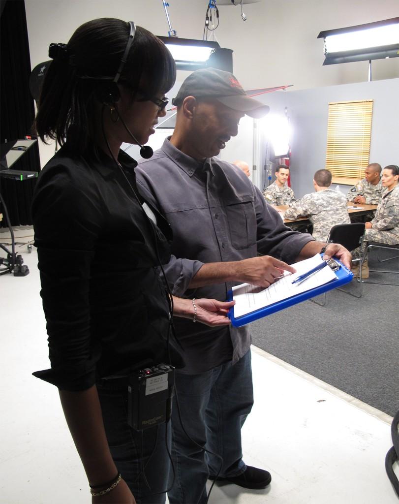 Two people reviewing a script